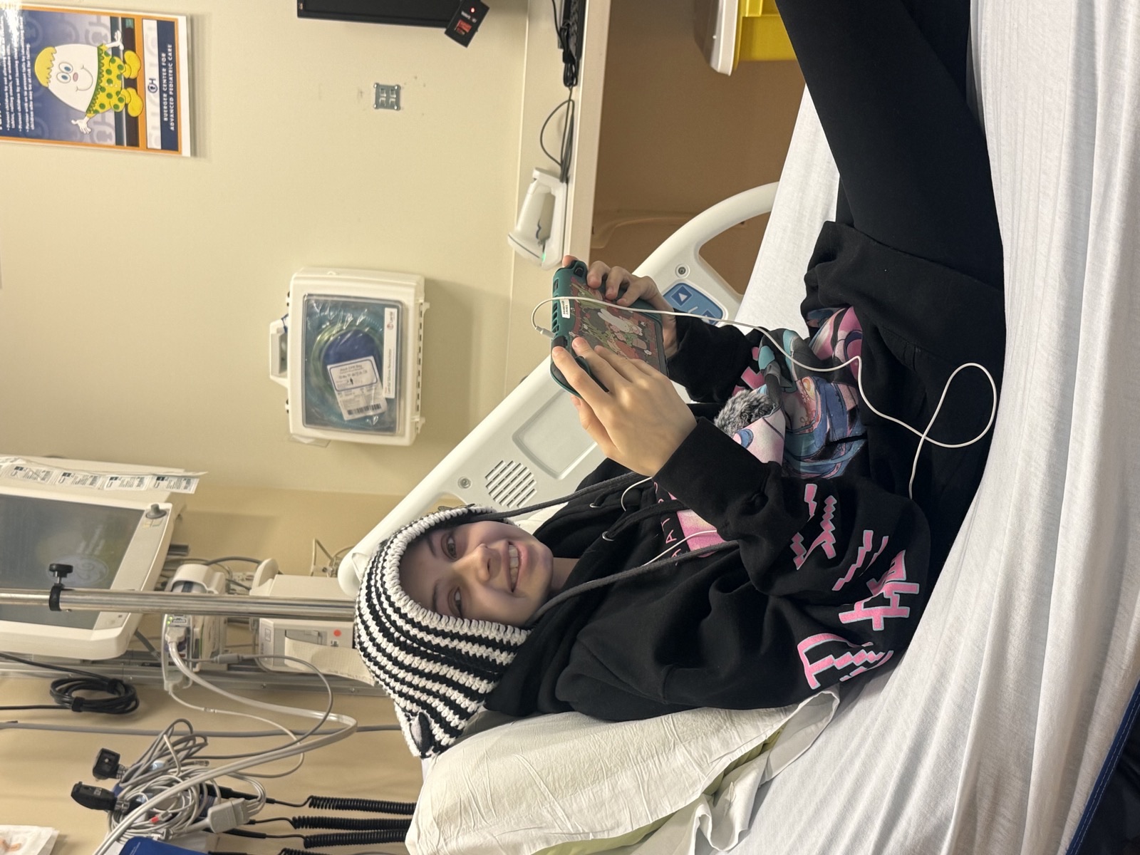 Olivia smiling in the hospital during her final months